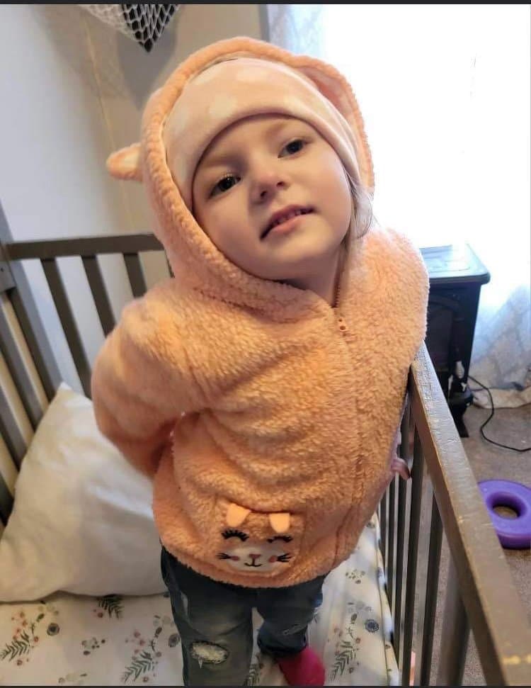 CHAMP beneficiary in a cozy hoodie at home