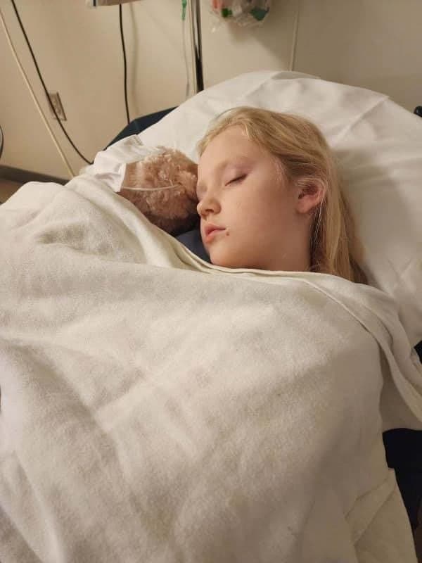 CHAMP beneficiary resting with a stuffed toy